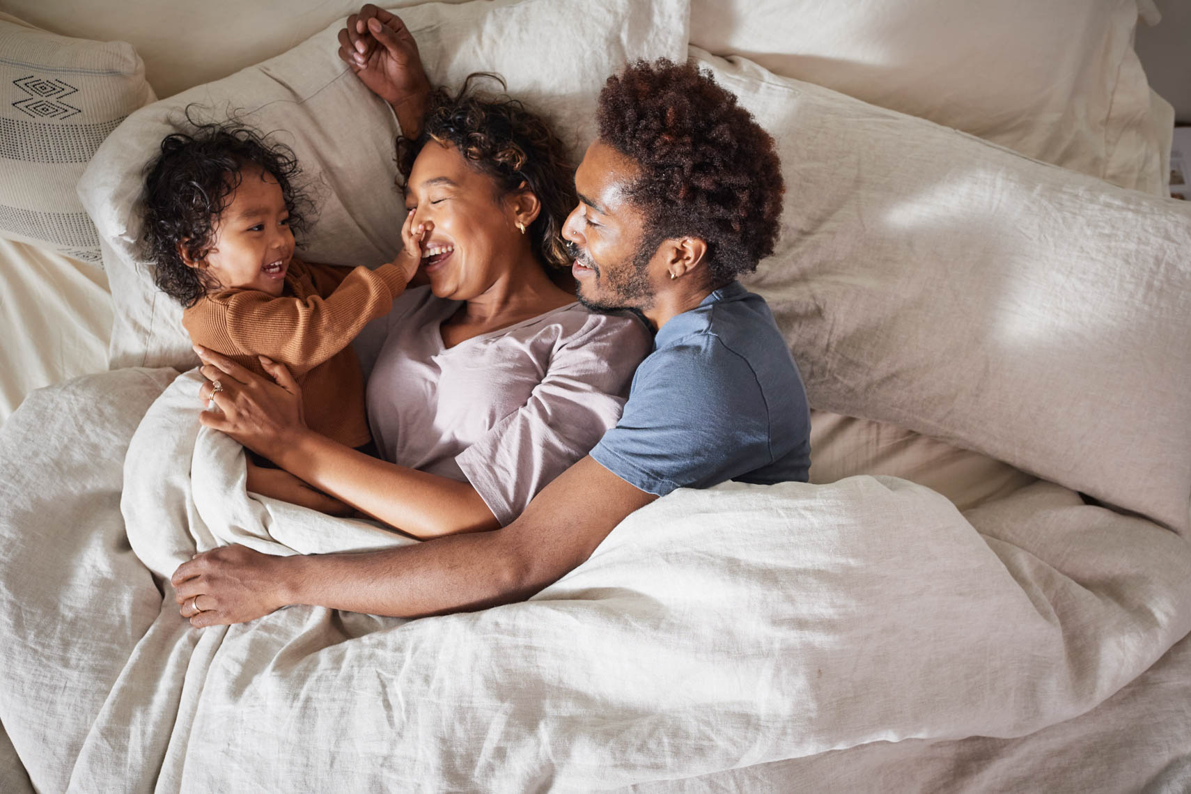 Family in bed on a sweet morning 