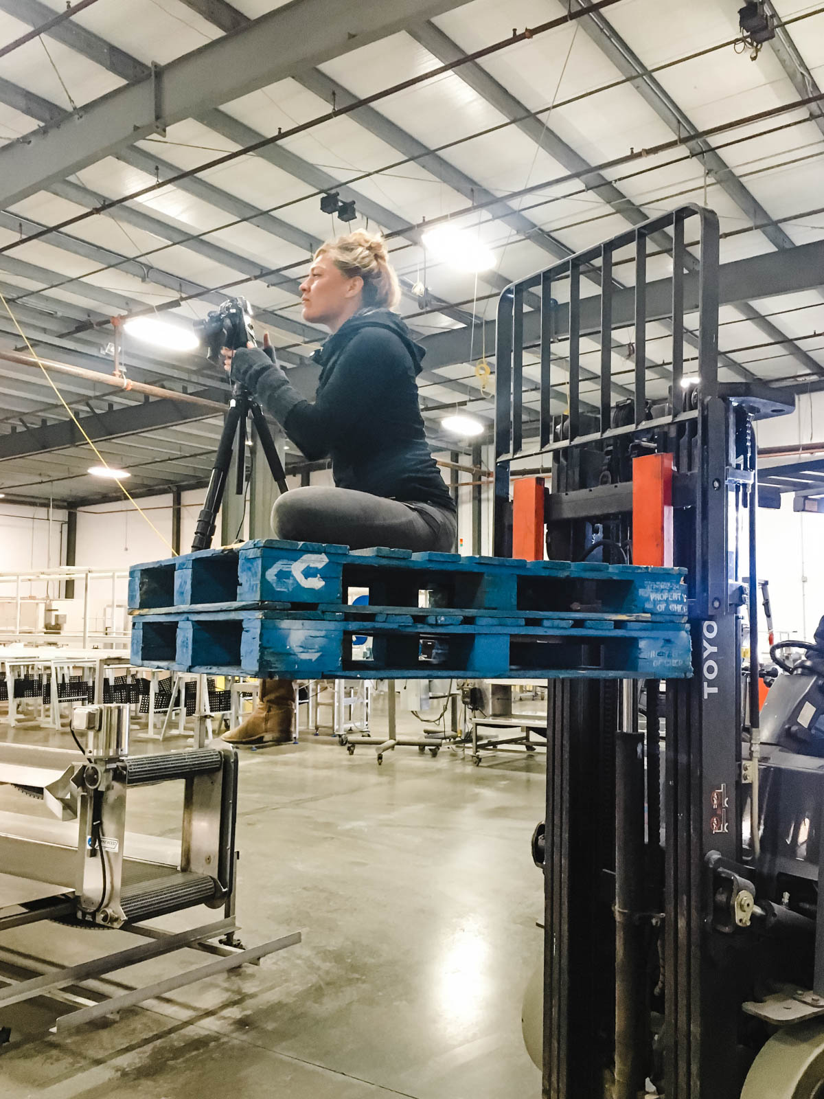 Dawn Heumann, Commercial Photographer on fork lift